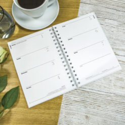 Image of the diary open in situ on a table.
