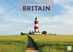 Journey Through Britain 2026 calendar front cover featuring a red and white lighthouse in a green field beneath blue sky.