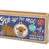 Cross stitch mini kit box featuring a Highland cow design in a small embroidery hoop. A cartoon cow is featured on the box, with floral accents and playful blue background. Includes text “Och aye the moo” and notes that a keyring is included.