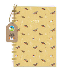 Front of this notebook featuring beige background with butterflies scattered around. There is also a little tag with the RSPB logo and the text In The Wild.