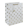 Large white gift bag with gold embossed Christmas trees, rope handle, and “Merry Christmas” tag
