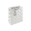 Medium white gift bag with gold embossed Christmas trees, rope handle, and “Merry Christmas” tag.