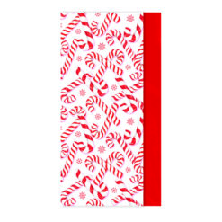Close-up of Christmas tissue paper featuring a repeating red and white candy cane design.