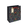 A navy Christmas gift bag with woodland pattern featuring trees, foliage and woodland animals. The bag has red handles and a gold tag.
