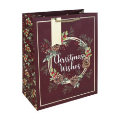 A Large gift bag with an image of a traditional wreath with the words Christmas Wishes in the centre and a gold tag attached.