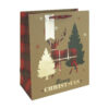 A Christmas gift bag which is kraft brown with a silhouette of a tartan stag next to trees. Text reads Merry Christmas. The bag has red handles and a silver gift tag.
