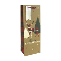 A Christmas bottle gift bag which is kraft brown with a silhouette of a tartan stag next to trees. Text reads Merry Christmas. The bag has red handles and a gold gift tag.