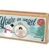 Festive cross stitch mini kit box featuring a snowman and Christmas tree on the front, and angel design in a small embroidery hoop, with text reading “You’re an angel” and “Keyring included.”