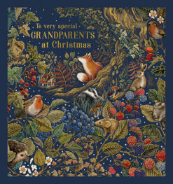 Christmas card with a deep blue woodland scene featuring a fox, badger, rabbit, mouse, hedgehog, and robins among colourful berries and branches. Includes the message “To very special Grandparents at Christmas” in elegant script.