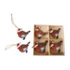A wooden box containing eight wooden robin hanging decorations.