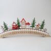 A wooden arched advent scene featuring Santa on a moped to count down the days to Christmas.