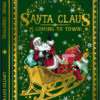 Book-shaped Christmas card featuring Santa Claus waving from a golden sleigh filled with presents, set against a rich green background with snowflakes and ornate gold detailing.