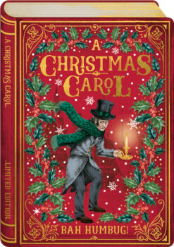 Festive book-shaped Christmas card featuring Ebenezer Scrooge in Victorian attire, holding a candle, with red background, holly, snowflakes, and gold “Bah Humbug!” lettering
