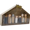 A wooden nativity scene with stable and seven figures.