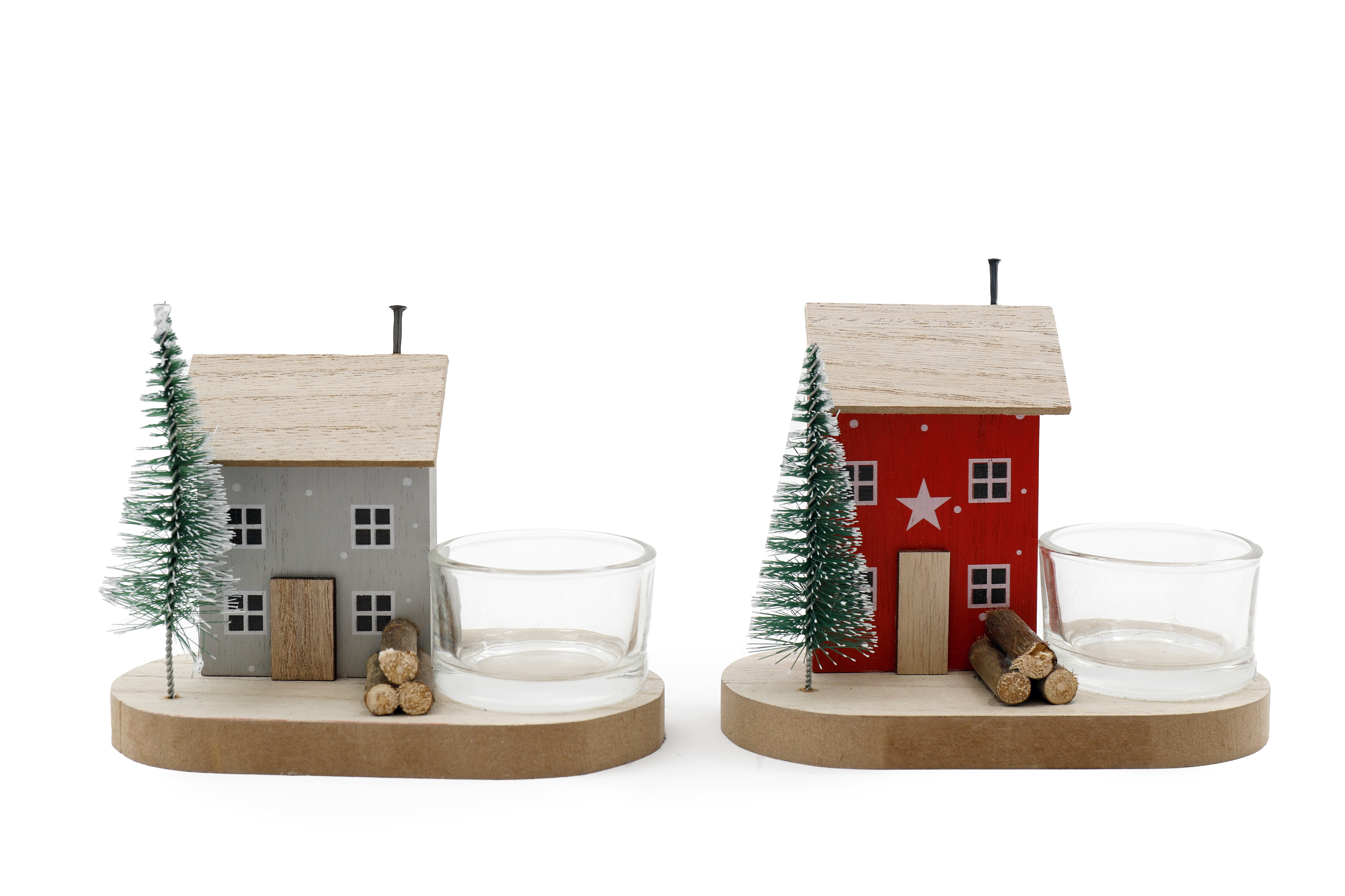 Two tea light holders. Each one has a small wooden house and a Christmas tree next to a round, clear tea light holder.