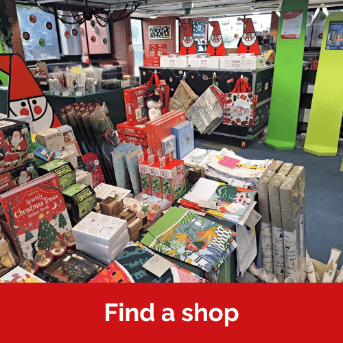 Text reads find a shop. Image of a Cards for Good Causes Christmas shop inside a Library.