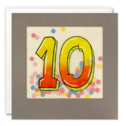 Square card with dark grey border. The number 10 is on the front in large graffiti style design. The numbers are yellow and orange. Behind the number is a clear window behind which sits colourful paper confetti.