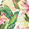 A pink arch-shaped card with illustrations of green hummingbirds and pink flowers. Gold text reads 'Wishing you a very happy birthday'.