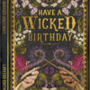 Card in a book design with an illustration of two hands holding sticks which come together in the centre with a mystical trail of purple. The hands are surrounded by florals and botanicals and there is a gold foil border against a dark background. Text in gold reads 'Have a wicked birthday. From one witch to another'.