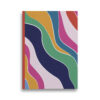A4 notebook with colourful waves pattern and a red spine.