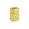 A small yellow gift bag with a repeating bee pattern and yellow ribbon handles.