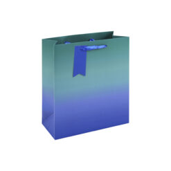 A medium gift bag with a green‑to‑blue ombre gradient, blue ribbon handles, and a matching blue tag.