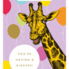 Greeting card with an illustration of a giraffe with a purple background decorated with colourful balloons. Text reads 'How old?!' and 'You're having a giraffe!'.