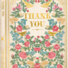 A greeting card in the style of a book. A colourful botanical illustration of the front of the card with pink and blue flowers, green leaves and gold birds surrounding gold text which reads 'Thank You'. Down the spine of the book is the text 'Thank You' and 'Limited Edition'.