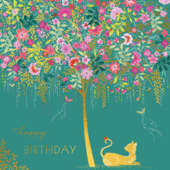 Square card featuring a gold cat with a ladybird on it's tail. The cat sits beneath a gold tree which has bright, colourful flowers. Gold text at the bottom of the card reads 'happy birthday'. The card has a green background.